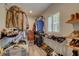 Walk-in closet with a generous amount of hanging clothes, shelves for shoes, and accessories at 7809 Alafia Dr, Riverview, FL 33578