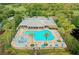 Aerial view of community pool, clubhouse, and playground at 8520 Reedville St, New Port Richey, FL 34654