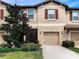 Two-story townhome with a two-car garage and updated exterior at 8520 Reedville St, New Port Richey, FL 34654