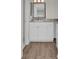 Bathroom with white cabinets and granite countertop at 9 Haig Pl # 612, Dunedin, FL 34698