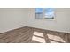 Bedroom with large window, wood-look flooring, and an inviting atmosphere at 9 Haig Pl # 612, Dunedin, FL 34698