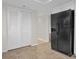 Kitchen features white cabinets, black appliances and tile floor at 9 Haig Pl # 612, Dunedin, FL 34698