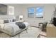 Main bedroom with water view, large window, and plush bed at 9 Haig Pl # 612, Dunedin, FL 34698