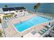 Community pool with plenty of lounge chairs at 9 Haig Pl # 612, Dunedin, FL 34698