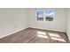 Bright bedroom with wood-look flooring and ocean view at 9 Haig Pl # 612, Dunedin, FL 34698