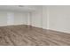 Large living room with neutral walls and wood-look flooring at 9 Haig Pl # 612, Dunedin, FL 34698