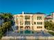 Multi-level home with pool and expansive patio, overlooking the water at 774 Nina Dr, Tierra Verde, FL 33715