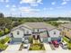 Two story townhouses with attached garages and neatly landscaped yards at 5228 New Friendship Pl, Tampa, FL 33619