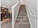 Modern carpeted staircase with a view of the kitchen at 5228 New Friendship Pl, Tampa, FL 33619