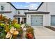 Modern 2-story townhome with gray garage doors and landscaping at 5228 New Friendship Pl, Tampa, FL 33619
