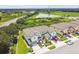 Aerial view of townhouses with surrounding landscape at 5228 New Friendship Pl, Tampa, FL 33619