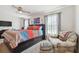 Bright bedroom with a king-size bed and sitting area at 5228 New Friendship Pl, Tampa, FL 33619
