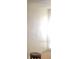 Simple, unfurnished room with textured walls and a small table at 6100 12Th S St # 211, St Petersburg, FL 33705