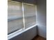 Bright room featuring large windows with blinds, offering ample natural light at 6100 12Th S St # 211, St Petersburg, FL 33705