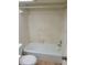 Bathroom with shower/tub combo, tile walls, and a toilet at 6100 12Th S St # 211, St Petersburg, FL 33705