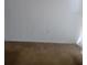 Empty wall with two outlets and stained carpet at 6100 12Th S St # 211, St Petersburg, FL 33705