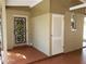 Home's side entrance with storage and access doors at 15654 Darien Way, Clearwater, FL 33764