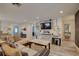 Spacious living area featuring a comfortable sectional and ample natural light at 7809 Alafia Dr, Riverview, FL 33578