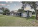 Large backyard with screened pool and grassy area at 7809 Alafia Dr, Riverview, FL 33578