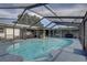 Relaxing screened-in pool area with plenty of space for entertaining at 7809 Alafia Dr, Riverview, FL 33578