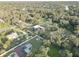 Aerial view of property showing house, pool, and large lot with mature trees at 7809 Alafia Dr, Riverview, FL 33578