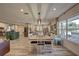 Farmhouse style dining room with a large table and natural light at 7809 Alafia Dr, Riverview, FL 33578