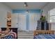 Bright bedroom with double closets and wood-look floors at 7809 Alafia Dr, Riverview, FL 33578