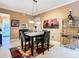 A cozy dining room features modern lighting, neutral colors, and stylish décor at 6816 Dali Ave # 101, Land O Lakes, FL 34637