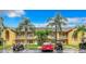 Well maintained, two-story building with palm trees, golf carts, and convenient parking at 6816 Dali Ave # 101, Land O Lakes, FL 34637