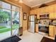 Bright kitchen featuring stainless steel appliances, and a sliding door to the outside at 6816 Dali Ave # 101, Land O Lakes, FL 34637