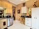 This kitchen features stainless steel appliances, black countertops, a breakfast bar, and crisp white cabinets at 6816 Dali Ave # 101, Land O Lakes, FL 34637
