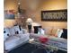 Comfortable living room featuring contemporary decor and a view into the dining area with bar at 6816 Dali Ave # 101, Land O Lakes, FL 34637