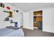 A twin bed, a closet with cedar lining, and built-in shelves in this bedroom at 9406 Rainbow Ln, Port Richey, FL 34668