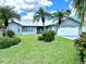 Landscaped front yard and newly painted home at 4262 Perry Pl, New Port Richey, FL 34652