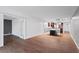 Open concept living area with wood floors and kitchen views at 2539 Gary Cir # 603, Dunedin, FL 34698