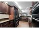 Modern kitchen with stainless steel appliances and ample cabinetry at 2539 Gary Cir # 603, Dunedin, FL 34698