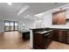 Kitchen with granite counters, dark wood cabinets, and island at 2539 Gary Cir # 603, Dunedin, FL 34698