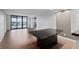Living room with wood floors and sliding glass doors to balcony at 2539 Gary Cir # 603, Dunedin, FL 34698