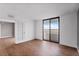 Bedroom with wood flooring and French doors at 2539 Gary Cir # 603, Dunedin, FL 34698