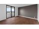 Bedroom with wood floors and access to balcony at 2539 Gary Cir # 603, Dunedin, FL 34698