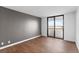 Bedroom with wood floors and gray accent wall at 2539 Gary Cir # 603, Dunedin, FL 34698