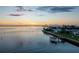 Aerial view of waterfront home at sunset with private dock at 2539 Gary Cir # 603, Dunedin, FL 34698