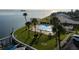 Community pool with waterfront access and picnic tables at 2539 Gary Cir # 603, Dunedin, FL 34698