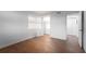 Bright bedroom featuring wood flooring and ample closet space at 2539 Gary Cir # 603, Dunedin, FL 34698