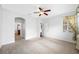 Spacious bedroom with ceiling fan and window coverings at 1008 Blue Heron Way, Tarpon Springs, FL 34689