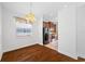 Hardwood floor dining room with chandelier and kitchen access at 1008 Blue Heron Way, Tarpon Springs, FL 34689