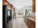 Spacious kitchen featuring granite countertops and stainless steel appliances at 1008 Blue Heron Way, Tarpon Springs, FL 34689