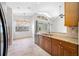 Kitchen with granite countertops and wooden cabinetry at 1008 Blue Heron Way, Tarpon Springs, FL 34689