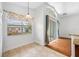 Bright dining area with hardwood floors and sliding glass doors at 1008 Blue Heron Way, Tarpon Springs, FL 34689