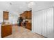 Well-equipped kitchen with ample cabinetry and granite counters at 1008 Blue Heron Way, Tarpon Springs, FL 34689